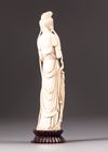 An ivory figure of a lady holding phoenix feathers