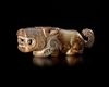 A JADE OF A RECUMBENT TIGER WITH ITS TAIL CURLED UPWARD, CHINA, SHANG DYNASTY