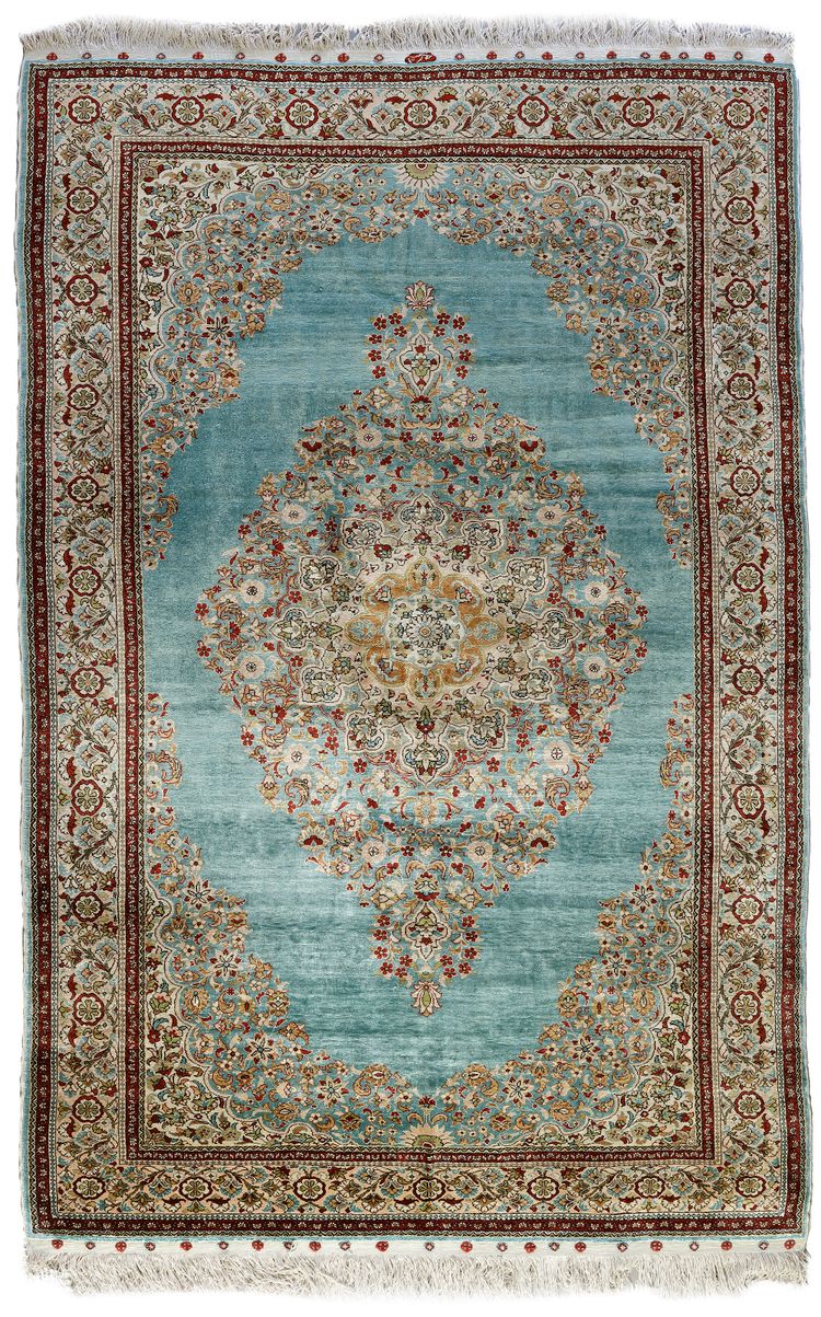 A SIGNED SILK TURKISH HEREKE RUG, 1950