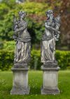 A PAIR OF CONTINENTAL SCULPTED LIMESTONE MODELS REPRESENTING SPRING AND AUTUMN, 20TH CENTURY