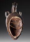 AN AFRICAN MASK WITH BIRD CREST, EARLY 20TH CENTURY