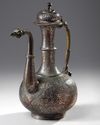 A TINNED COPPER CALLIGRAPHY EWER
