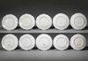 A SET OF TEN WHITE LIMOGES PORCELAIN PLATES, NAPOLEON III PERIOD, LATE 19TH CENTURY