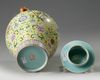 A Chinese yellow-ground famille rose 'Eight Immortals' vase and cover