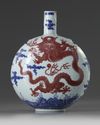 A Chinese underglaze blue and copper-red-decorated 'dragon' moonflask