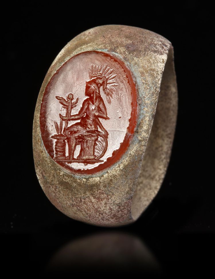 A ROMAN BRONZE RING WITH CARNELIAN INTAGLIO, CIRCA 2ND-3RD CENTURY A.D.