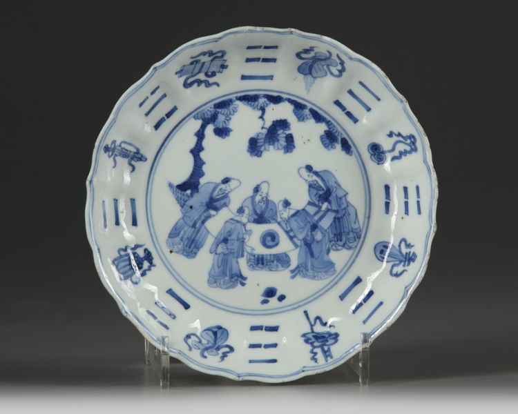 A Chinese blue and white 'Eight Daoist Emblems' barbed rim dish
