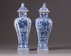 Two Chinese blue and white vases with covers