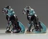 A pair aubergine and turquoise decorated Buddhist lions