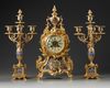 A FRENCH CHAMPLEVÉ ENAMEL CLOCK SET, 19TH CENTURY