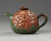 A Chinese Yixing green with brown-clay 'lotus & butterfly' teapot