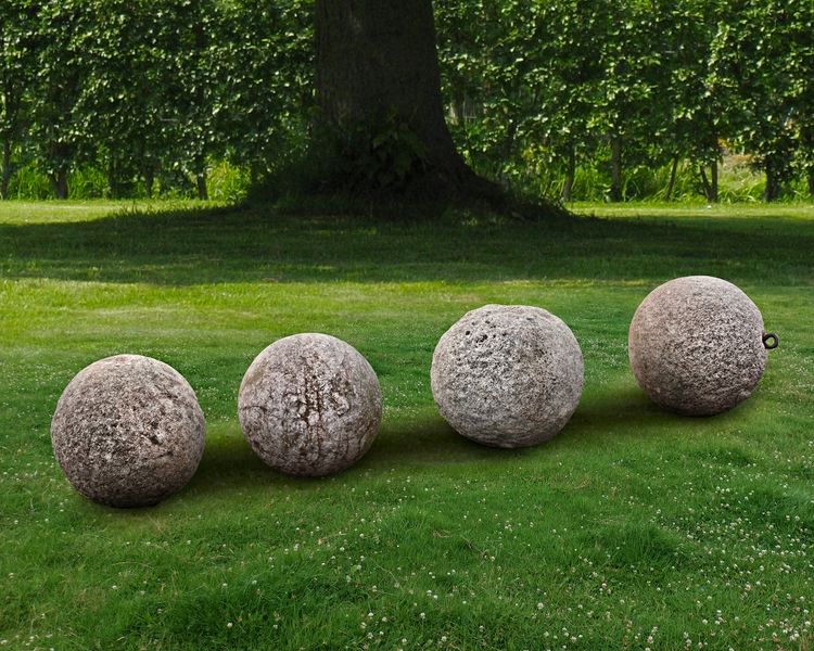 A GROUP OF FOUR STONE ORNAMENTAL SPHERES, LATE 18TH CENTURY
