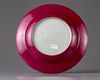 A famille rose 'lady and boys' ruby-back dish