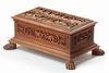A DEEPLY CARVED SANDALWOOD CHEST WITH HUNTING SCENES