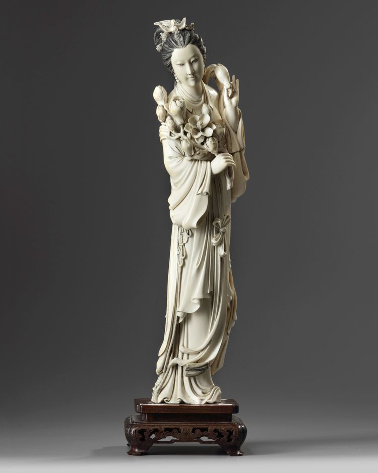 A large Chinese ivory carving of a lady