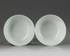 A pair of Chinese green glazed 'dragon' bowls