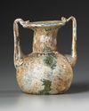 A ROMAN GLASS JAR WITH TWO HANDLES, CIRCA 3RD-4TH CENTURY AD