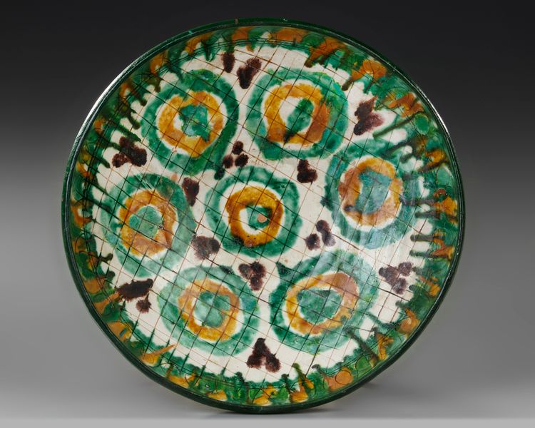 A NISHAPUR TANG SPLASHED BOWL, PERSIA, 10TH-11TH CENTURY
