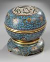 A Chinese cloisonné enamel 'Islamic market' round box and cover and stand