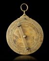 A BRASS ASTROLABE SIGNED BY MUḤAMMAD IBN FATTŪḤ AL-KHAMĀ’IRĪ, SEVILLE (SPAIN), DATED 625 AH / 1227–28 AD