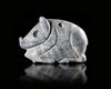 A RECLINING BOAR AMULET IN VARIEGATED GREY CALCITE, 3000-2000 BC