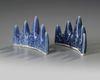 A pair of Chinese blue glazed 'mountain' brush rests