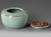 A CHINESE CELADON GLAZED DECORATED DRAGON' WATERPOT WITH COVER