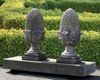 A PAIR OF CARVED LIMESTONE PIER FINIALS, 20TH CENTURY