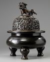 A large Chinese bronze tripod censer
