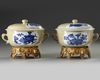 A PAIR OF CHINESE CAFE-AU-LAIT-GROUND BLUE AND WHITE POTICHES AND COVER, KANGXI PERIOD (1662-1722)