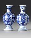A PAIR OF BLUE AND WHITE ‘FLOWER AND FOLIAGE’ VASES, KANGXI PERIOD