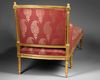 A FRENCH LOUNGE CHAIR, LOUIS XVI STYLE, LATE 19TH CENTURY