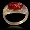 A ROMAN BRONZE RING WITH CARNELIAN INTAGLIO, CIRCA 2ND-3RD CENTURY A.D.
