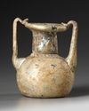A ROMAN GLASS JAR WITH TWO HANDLES, CIRCA 3RD-4TH CENTURY AD