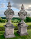 A PAIR OF CARVED LIMESTONE URNS AND COVERS IN 19TH CENTURY STYLE, SECOND HALF 20TH CENTURY