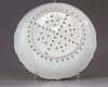 A blue and white strawberry strainer