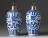 A pair of silver-mounted Chinese blue and white ovoid vases and covers