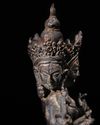 A SINO-TIBETAN BRONZE FIGURE OF THREE-HEADED SEATED BODHISATTVA