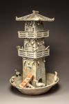 A green glazed pottery model of a watch tower