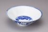 A blue and white conical bowl