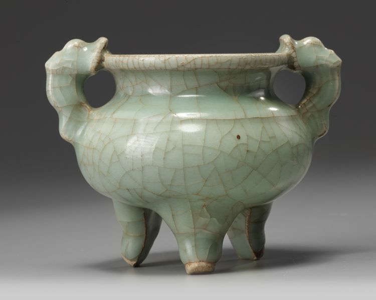 A Chinese celadon crackle-glazed tripod censer