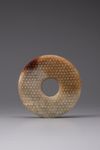 A pale celadon and russet jade bi disc