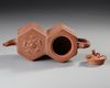 A CHINESE DOUBLE HEXAGONAL YIXING TEAPOT, 19TH CENTURY