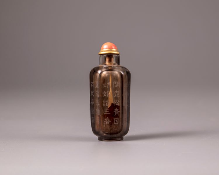A Chinese smokey-quartz hexagonal inscribed snuff bottle
