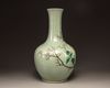 A Chinese celadon-ground famille rose bottle vase