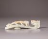 A Chinese pale celadon jade 'dragon and chilong' belt hook