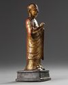 A Chinese gilt-lacquered bronze figure of a monk