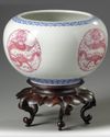 A pair of Chinese famille rose 'dragon' jardinieres
