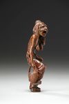 A Box Wood Netsuke of an Yamauba (Mountain Ogress)
