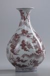 A Chinese blue and white and underglaze copper red 'dragon' pear-shaped vase, yuhuchunping